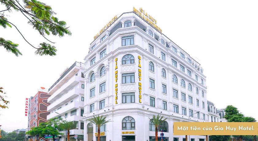 a large building with a clock on the front of it, Gia Huy Hotel in Haiphong
