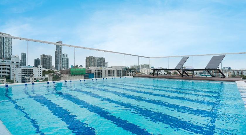 a large swimming pool in a large city, Hotel Amber Sukhumvit 85 (SHA Extra Plus) in Bangkok
