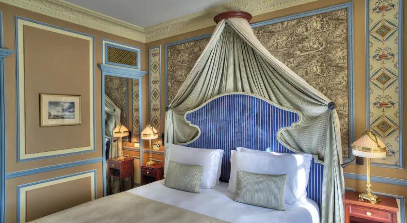 a bedroom with a large bed and a large window, Intercontinental Bordeaux Le Grand Hotel in Bordeaux