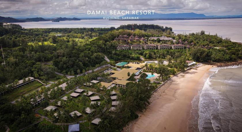 a beach filled with lots of palm trees, Damai Beach Resort in Kuching