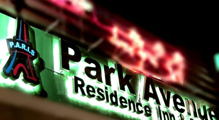a neon sign that is on top of a building, Park Avenue Residence Inn and Suites in Davao City