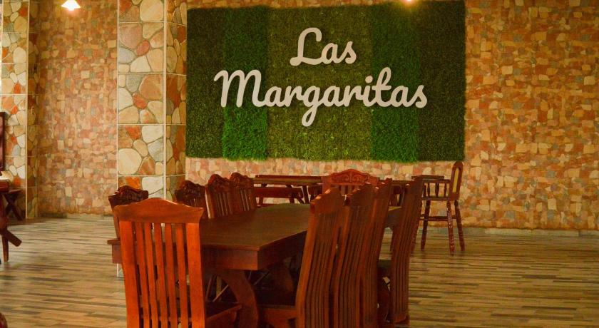 a dining room table with a sign on it, Hotel y Restaurante Las Margaritas in San Miguel