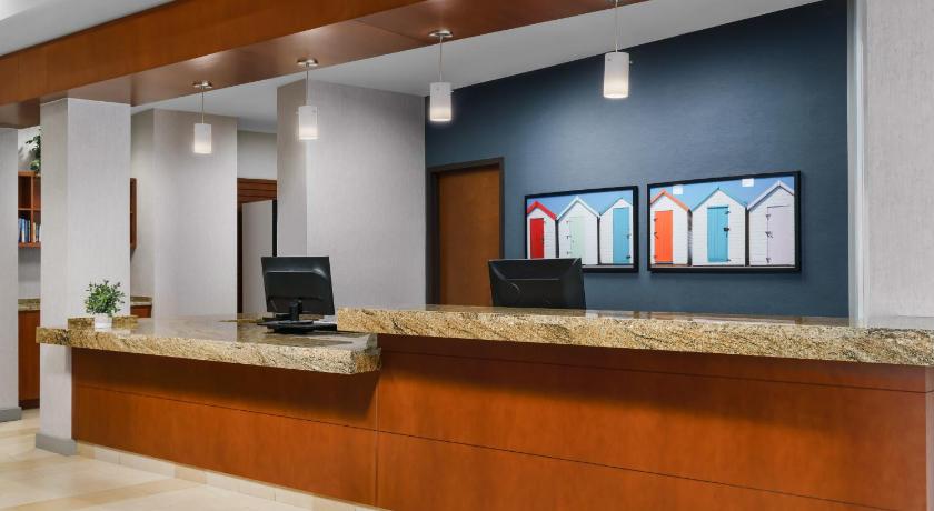 a large room with a large screen tv on the wall, Hyatt House Ft. Lauderdale Airport South in Fort Lauderdale (FL)