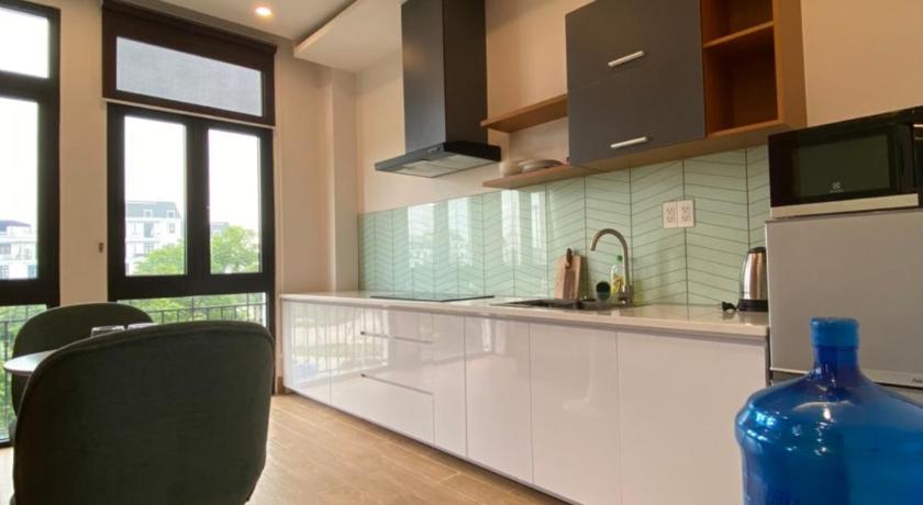 a kitchen with a sink and a chair in it, Vinhomes Imperia in Haiphong