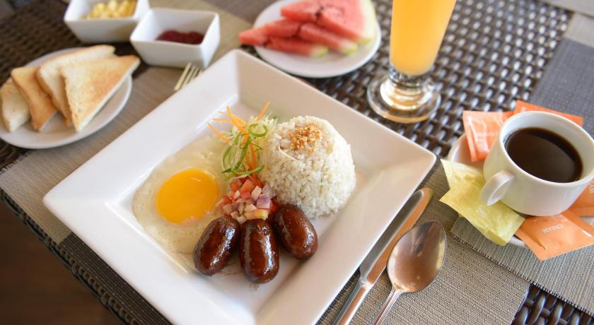 a white plate topped with different types of food, Holiday Suites in Palawan