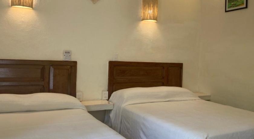 Image of Double Room with Two Double Beds and Garden View 1