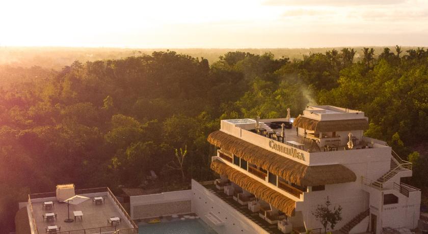 a large building with a large swimming pool in front of it, Bohol Coastal View Hotel in Bohol