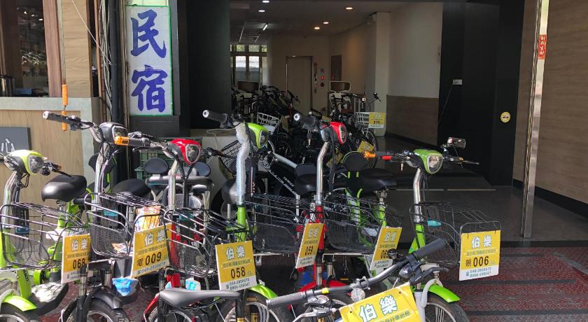 motorcycles are parked in a parking lot, Sun Moon Lake Long Xing Homestay in Nantou