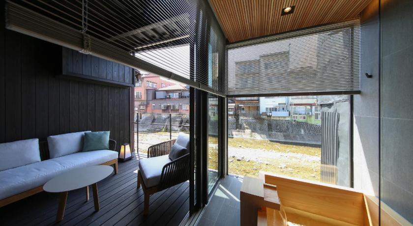 a living room filled with furniture and a window, IORI Stay in Takayama