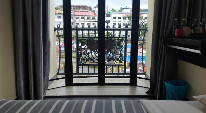 a window with a view of the ocean, Hong Kong Hotel in Cameron Highlands