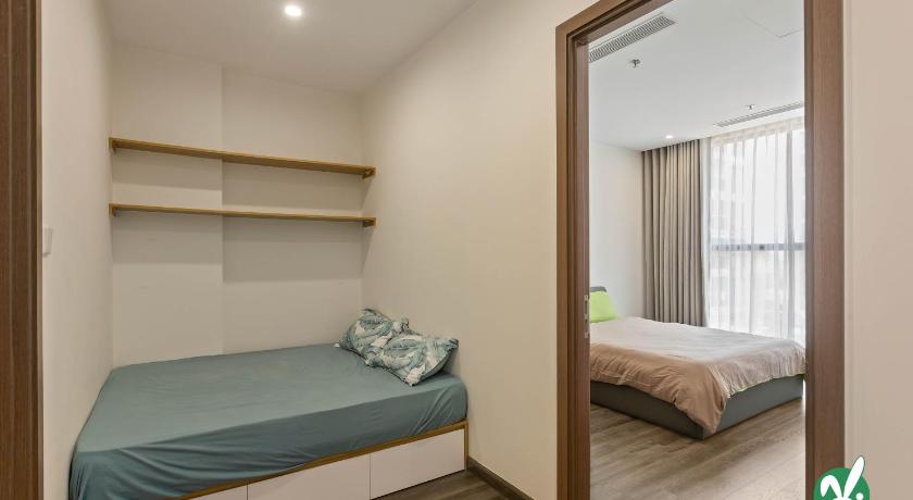 a bedroom with a bed and a window, Bunnys Homes - Managed by WiWi - Vinhomes Ocean Park in Gia Lam