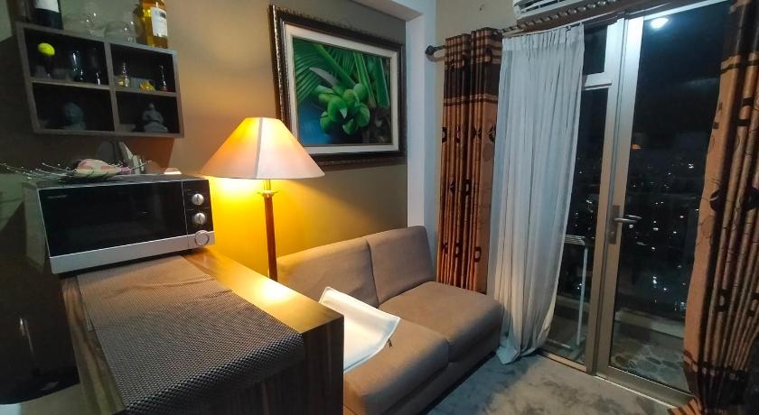 a living room filled with furniture and a tv, Apartemen 2br m-squere Cibaduyut  in Bandung