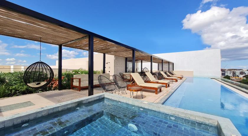 Big Studio at KAAB BY THE BEACH with roof top pool, sauna and Jacuzzi near Paseo del Carmen Mall photo
