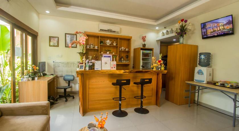 a living room filled with furniture and appliances, Anindya Homestay  in Bali
