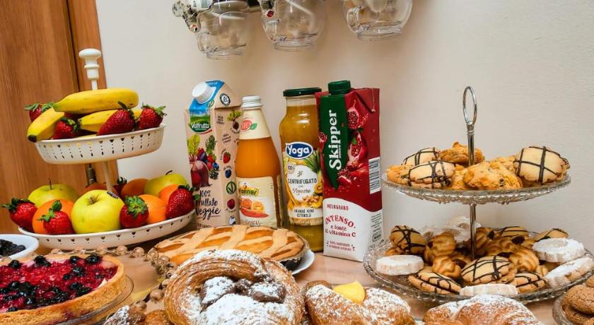 a table topped with lots of different types of pastries, Bed and Breakfast Port View in Civitavecchia