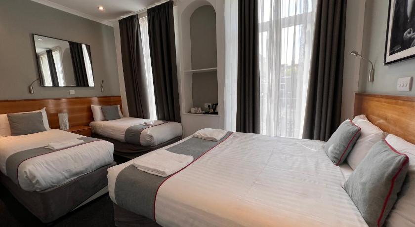 Immagine di Camera Quadrupla Deluxe (Deluxe Quad Room) 0