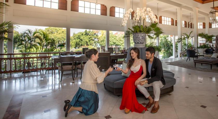 a man and woman are sitting in a hotel lobby, Centara Grand Beach Resort & Villas Hua Hin (SHA Extra Plus) in Hua Hin / Cha-am