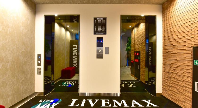 a sign that is on the wall of a building, HOTEL LiVEMAX Fukuoka Tenjin WEST in Fukuoka