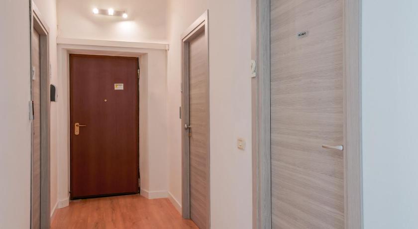 a room with a door leading to a hallway, Bissenti Rooms - Eja Sardinia in Cagliari