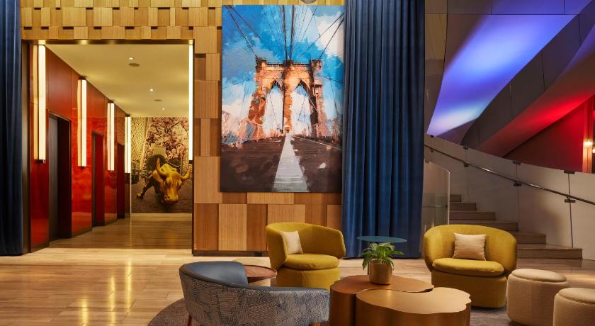 a living room filled with furniture and a painting on the wall, Hyatt Centric Wall Street New York in New York (NY)