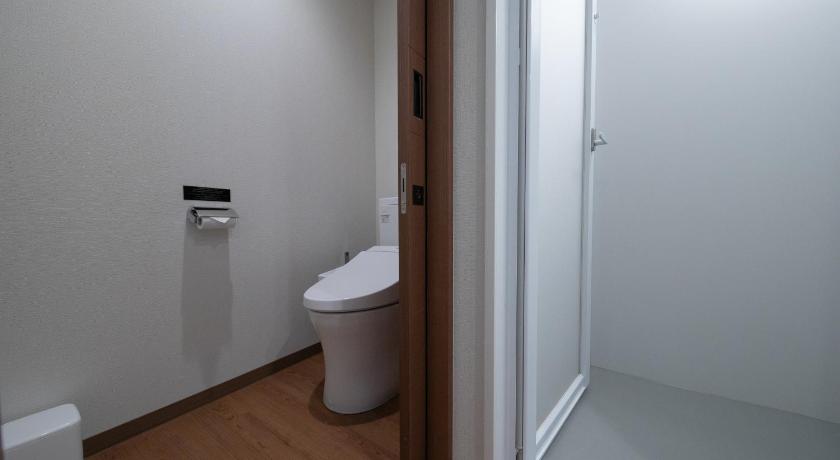 a bathroom with a toilet and a sink, Hotel Munin Furano in Furano