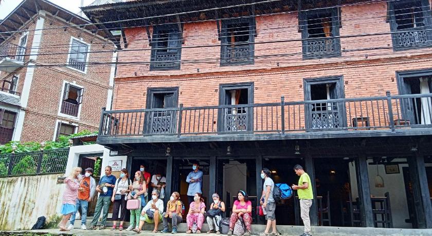 people standing outside of a building, Matina Chen in Bandipur
