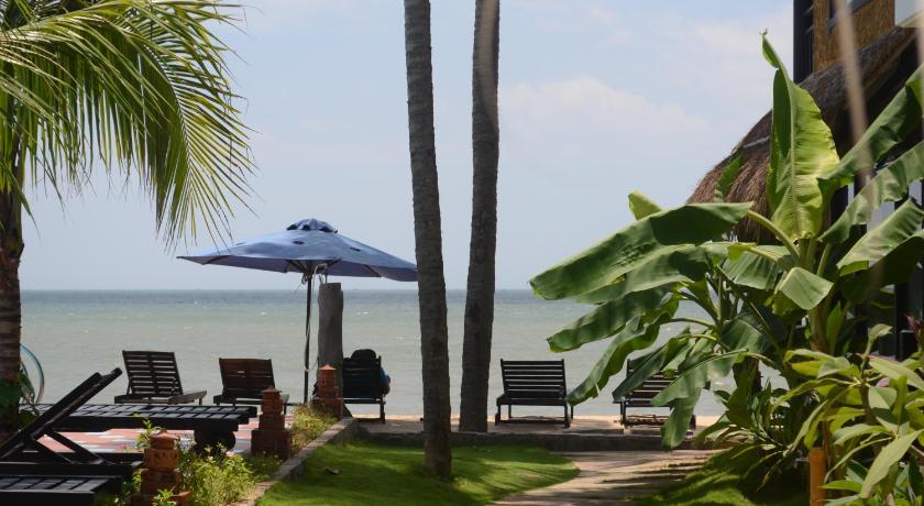 a beach area with umbrellas and chairs, Rang Garden Beach Side Resort in Phan Thiet