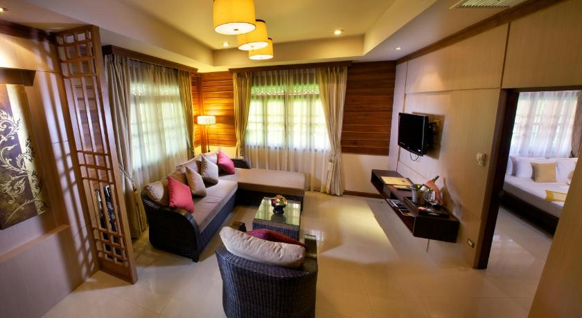 a living room filled with furniture and a tv, Smile House (SHA Plus+) in Koh Samui