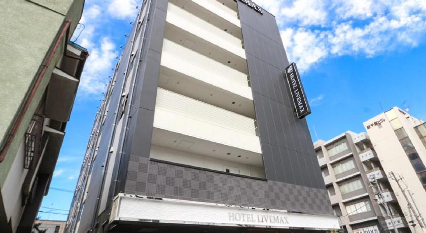 a tall building with a clock on the side of it, Hotel Livemax Chiba-ekimae in Chiba