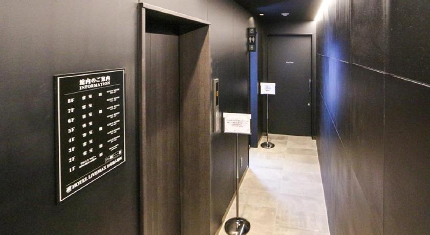a bathroom with a wall mounted to the wall, Hotel Livemax Nihonbashi-Ningyocho in Tokyo