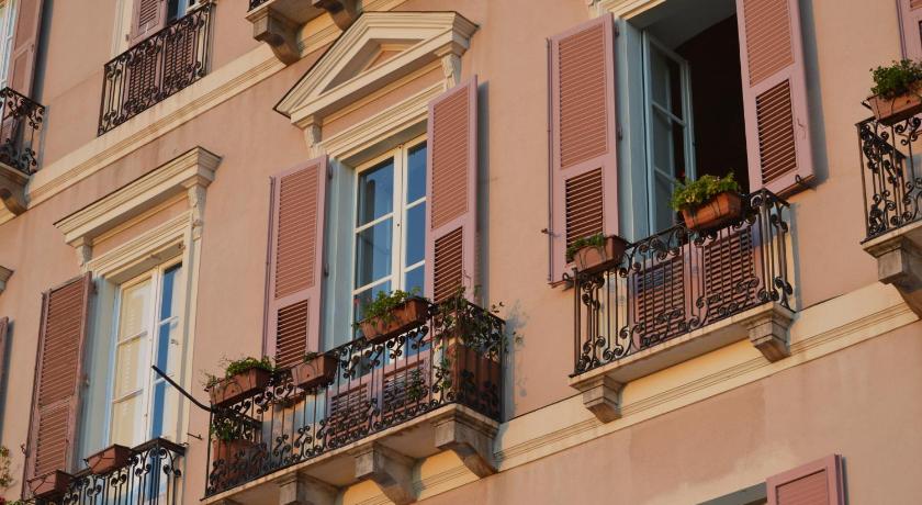 a row of windows with a view of a city, Relais Santa Croce in Cagliari