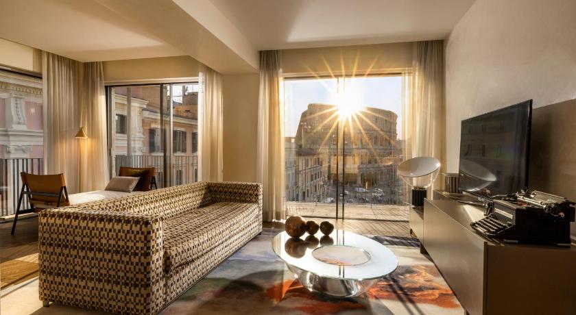 a living room filled with furniture and a tv, Hotel Palazzo Manfredi – Small Luxury Hotels of the World in Rome