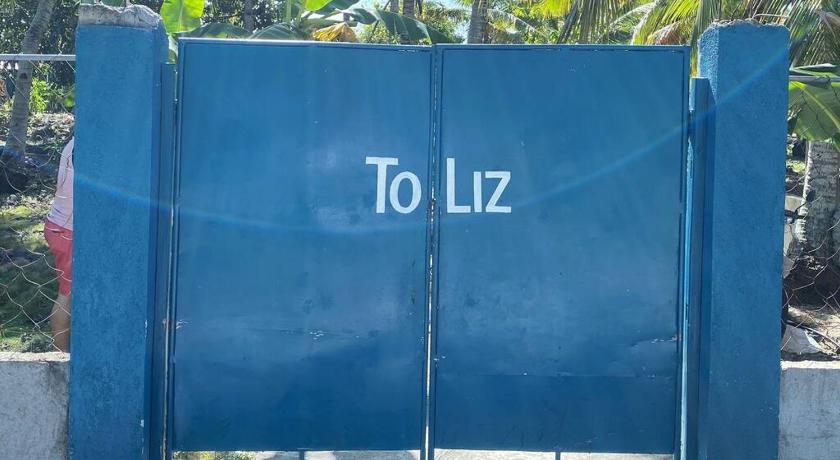 a blue bench with a sign on it, Toliz Beach House -Sipaway Island San Carlos City in San Carlos (Negros Occidental)