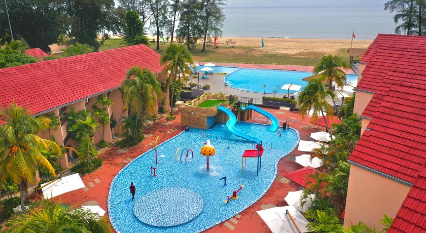 a swimming pool with a large blue and white boat on top of it, Holiday Villa Beach Resort & Spa Cherating in Cherating