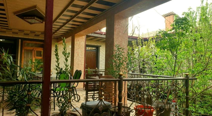 a garden area with a patio and a balcony, HOTEL-129 in Samarkand