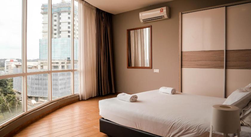 a hotel room with a bed and a window, Bangi Perdana Hotel in Kuala Lumpur