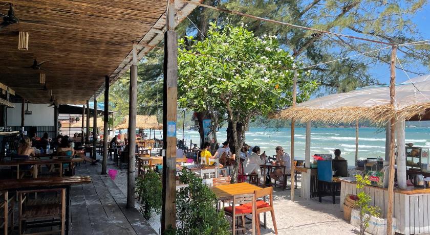 a patio area with tables, chairs and umbrellas, Onederz Koh Rong Sanloem in Koh Rong Sanloem
