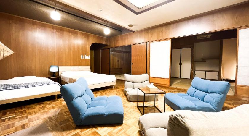 a living room filled with furniture and a couch, LESTEL NAHA in Okinawa Main island