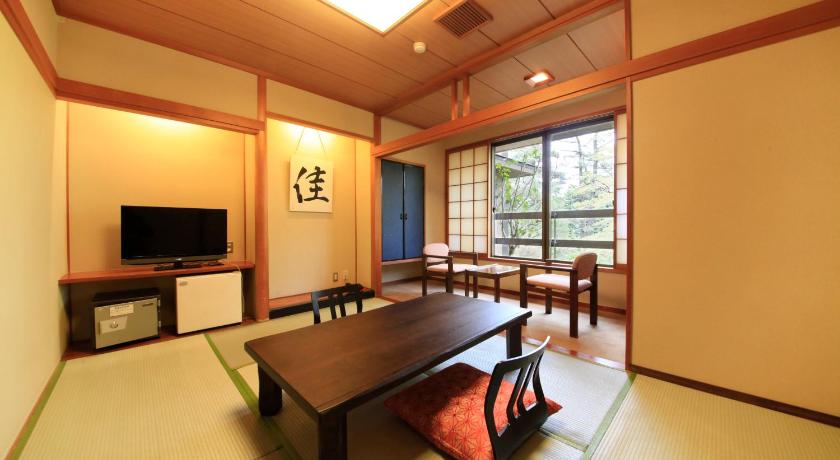 a living room filled with furniture and a table, Yutorelo An in Hakone
