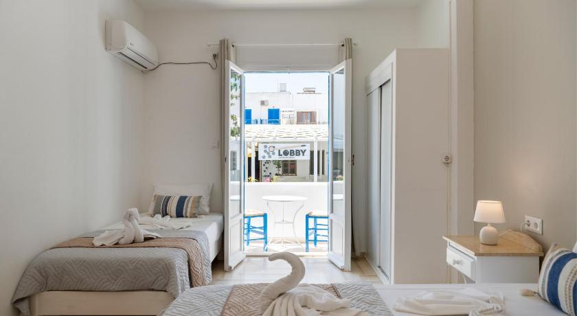 รูปของห้องพักสำหรับ 3 คน พร้อมเครื่องปรับอากาศ (Triple Room with Air Conditioning) 0