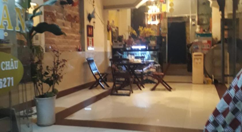 a living room filled with furniture and a large window, Ngoc Thuan Motel in Vung Tau