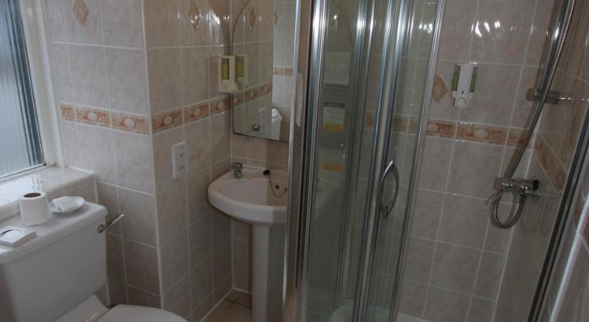 a bathroom with a shower, toilet, and sink, Inn at Ardgour in Ardgour