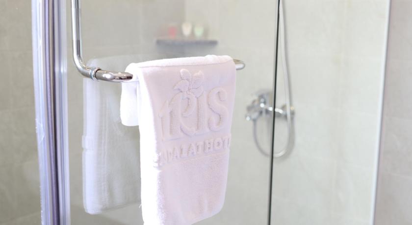 a towel hanging on a rack in a bathroom, Iris Dalat Hotel in Dalat