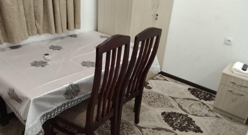 a dining room table with a chair next to it, HOTEL NEHAL KAMAL in Tashkent