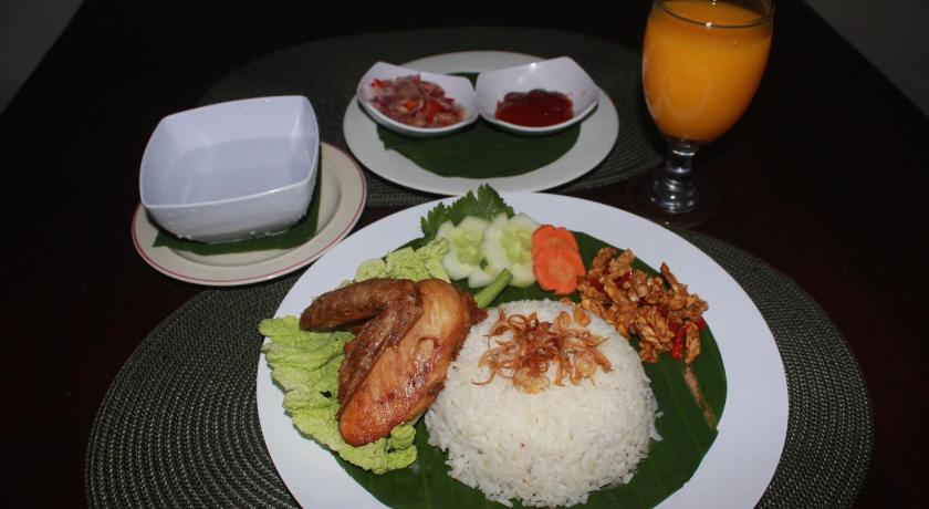 a plate of food on a table, Dangin Mangkalan Homestay in Bali