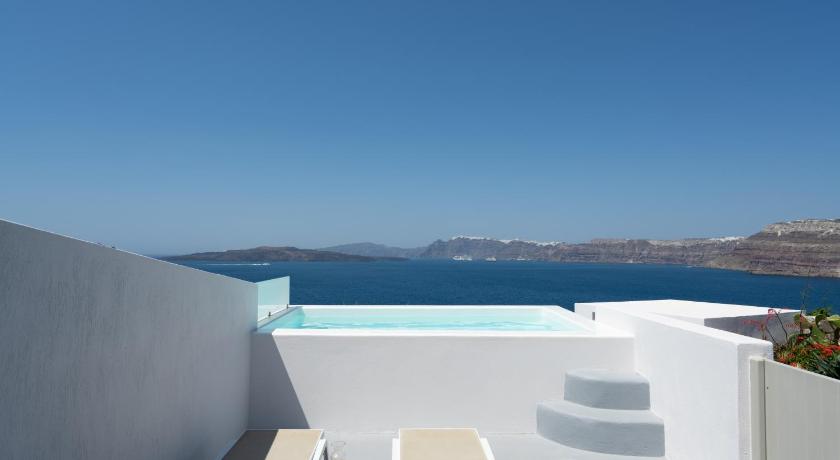 a view from a balcony overlooking a lake, Goulielmos Hotel in Santorini
