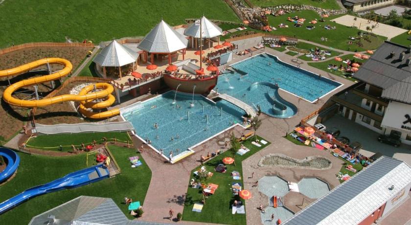 a large swimming pool in a small town, Gasthof Alpensport in Saalbach