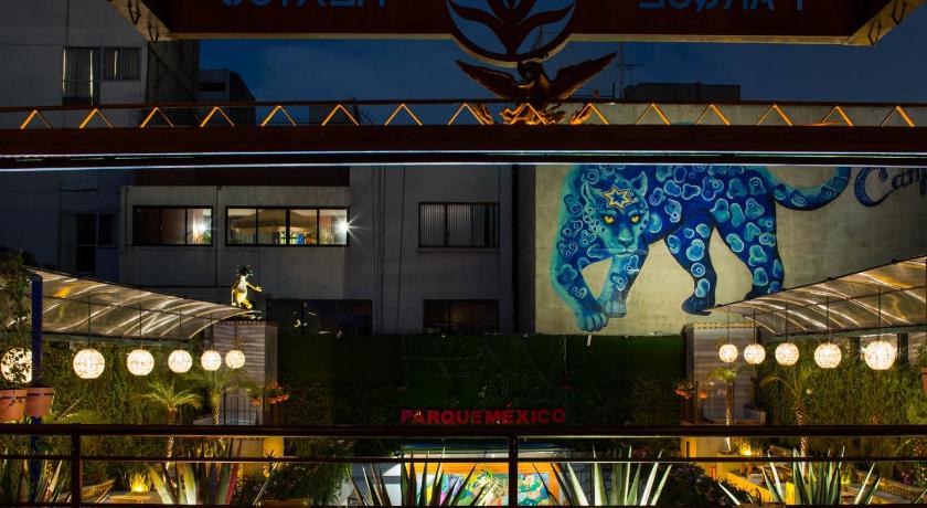 an outdoor restaurant with tables and umbrellas, Hotel Parque Mexico Boutique in Mexico City