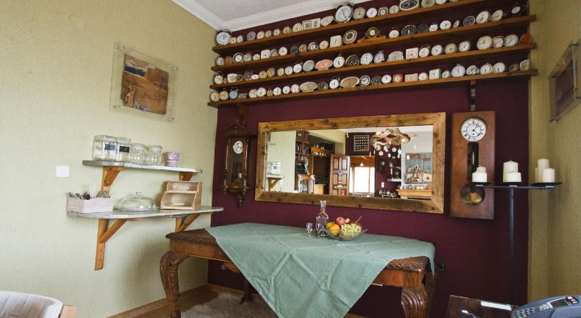 a kitchen with a table, chairs, and a vase of flowers, Guesthouse Mylona in Arachova
