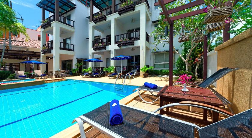 a pool with a pool table and chairs in it, Krabi Apartment Hotel in Krabi
